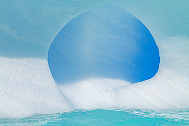 Iceberg detail showing the color blue around the Antarctic Peninsula, during the Austral summer months, Antarctica.