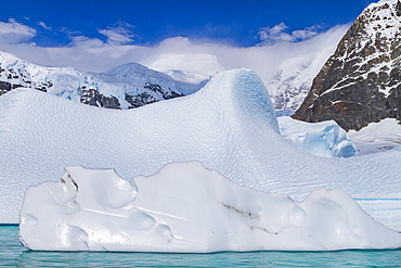 Iceberg detail showing the color blue around the Antarctic Peninsula, during the Austral summer months, Antarctica.