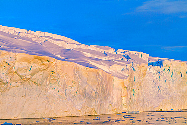 Sunset plays out on ice near Stonington Island, Antarctic Peninsula, Antarctica, Southern Ocean.
