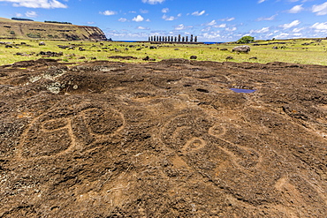 Petroglyphs carved in the lava at the 15 moai restored ceremonial site of Ahu Tongariki on Easter Island (Isla de Pascua) (Rapa Nui), UNESCO World Heritage Site, Chile, South America