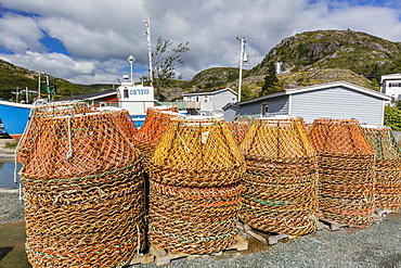 Lobster traps near fishing boat outside St. John's, Newfoundland, Canada, North America