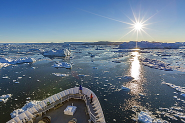 Expeditions ship amongst huge icebergs, Ilulissat, Greenland, Polar Regions