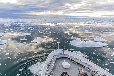 Expeditions ship amongst huge icebergs, Ilulissat, Greenland, Polar Regions