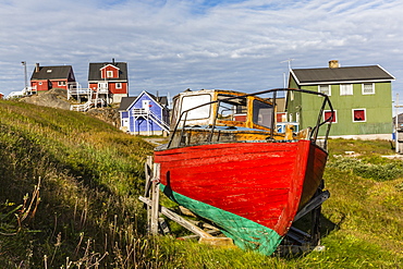 Brightly painted houses and boat in Sisimiut, Greenland, Polar Regions