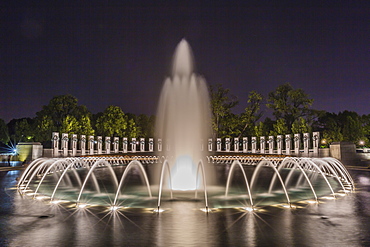 The fountains and sculpture of the World War II Memorial lit up at night, Washington D.C., United States of America, North America