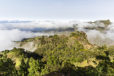 Fog shrouds the volcanic mountains surrounding Cova de Paul on Santo Antao Island, Cape Verde, Africa