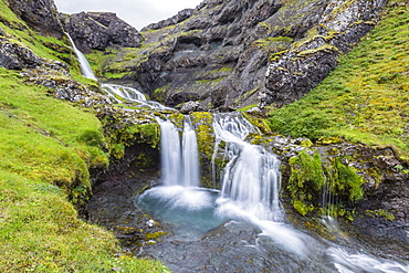 Small waterfall just outside the town of Grundarfjordur on the Snaefellsnes Peninsula, Iceland, Polar Regions