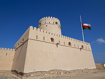 The Omani flag at half mast to signify the death of Sultan Qaboos at Ras Al Had Castle, Sultanate of Oman, Middle East