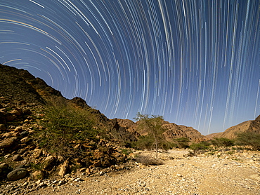 Star trails at night in Wadi Al Arbeen, Sultanate of Oman, Middle East