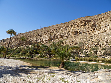 Natural swimming pools formed by flood waters in Wadi Bani Khalid, Sultanate of Oman, Middle East