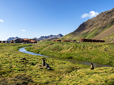 Rusting machinery and buildings at the abandoned whaling station at Stromness Harbor, South Georgia, Polar Regions