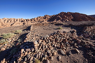 Remnants of rock structures in Tambo de Catarpe, Catarpe Valley in the Atacama Desert, Chile, South America