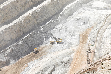 Huge machinery working the Chuquicamata open pit copper mine, the largest by volume in the world, Chile, South America