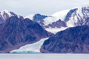 Tidewater glacier in the calm waters of Makinson Inlet, Ellesmere Island, Nunavut, Canada, North America