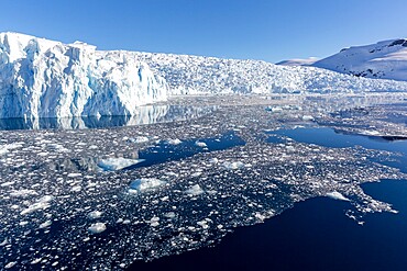 Snow-covered mountains, glaciers, and brash ice in Cierva Cove, Hughes Bay, Antarctica, Polar Regions