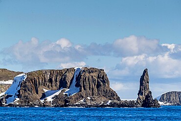 Basalt pinnacle and cliffs in English Strait in the South Shetland Islands, Antarctica, Polar Regions