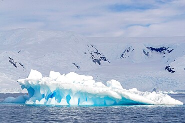 Snow-covered mountains, glaciers, and icebergs in Lindblad Cove, Charcot Bay, Trinity Peninsula, Antarctica, Polar Regions