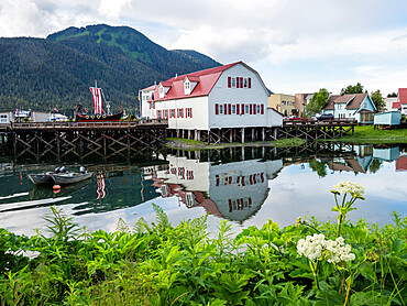 The Sons of Norway Hall reflected in the slough in Petersburg, Southeast Alaska, United States of America, North America