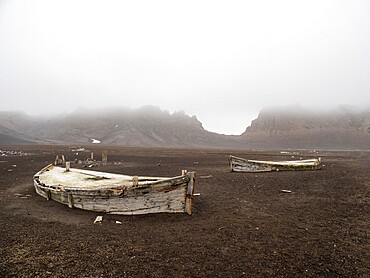 The remains of old water boats at Deception Island, an active volcano which last erupted in 1969, Antarctica, Polar Regions