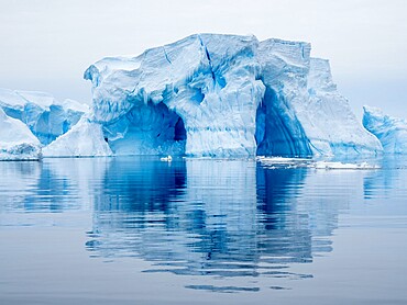 Large iceberg grounded on a reef at Peter I Island, Bellingshausen Sea, Antarctica, Polar Regions