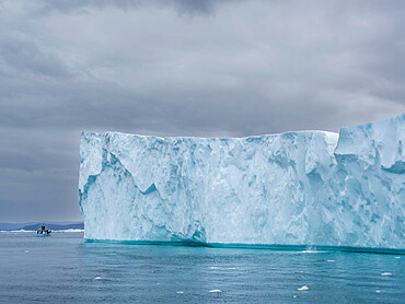 Tourists taking an ice tour in a small boat watching icebergs from the Ilulissat Icefjord, just outside Ilulissat, Greenland, Denmark, Polar Regions