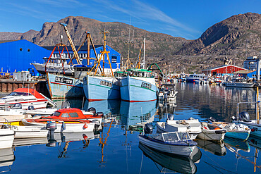 The inner boat harbor amongst the colorfully painted houses in the city of Sisimiut, Greenland, Denmark, Polar Regions