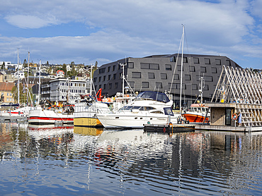 A view of the water front in the city of Tromso, located 217 miles north of the Arctic Circle, Tromso, Norway, Scandinavia, Europe