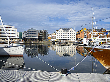 A view of the water front in the city of Tromso, located 217 miles north of the Arctic Circle, Tromso, Norway, Scandinavia, Europe