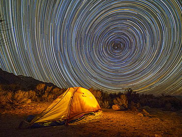 Night view of a pitched tent in the Alabama Hills National Scenic Area, California, USA.