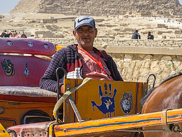 The driver of a decorated horse drawn carriage at the Pyramid complex, UNESCO World Heritage Site, Giza, near Cairo, Egypt, North Africa, Africa