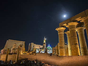 The Luxor Temple at night, under a full moon, constructed approximately 1400 BCE, UNESCO World Heritage Site, Luxor, Thebes, Egypt, North Africa, Africa