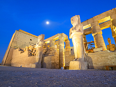 The Luxor Temple at night, under a full moon, constructed approximately 1400 BCE, UNESCO World Heritage Site, Luxor, Thebes, Egypt, North Africa, Africa