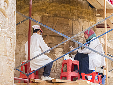 Workers at the Karnak Temple Complex, a vast mix of temples, pylons, chapels, and other buildings, Luxor, Egypt, North Africa, Africa