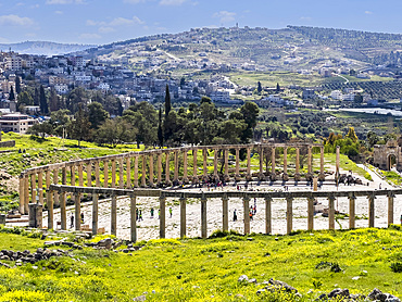 Columns frame the Oval Plaza in the ancient city of Jerash, believed to be founded in 331 BC by Alexander the Great, Jerash, Jordan, Middle East