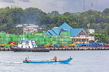 Boat and containers in the harbor in the city of Sorong, the largest city and the capital of the Indonesian province of Southwest Papua, Indonesia, Southeast Asia, Asia