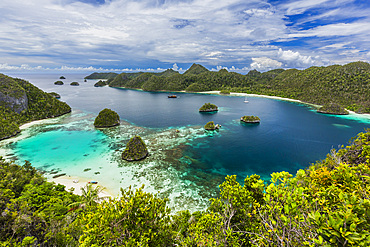 A view from on top of the small islets of the natural protected harbor in Wayag Bay, Raja Ampat, Indonesia, Southeast Asia, Asia