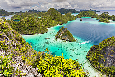 A view from on top of the small islets of the natural protected harbor in Wayag Bay, Raja Ampat, Indonesia, Southeast Asia, Asia