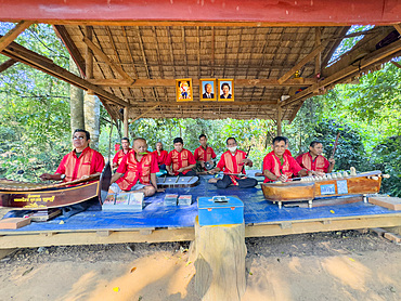 Survivors of the Khmer Rouge play together at Banteay Srei Temple in the area of Angkor, Cambodia, Indochina, Southeast Asia, Asia