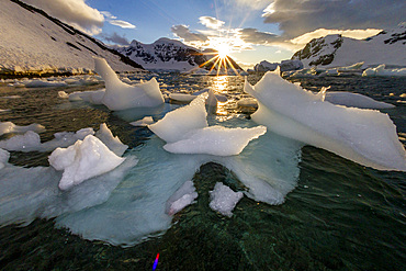 Sunset over bergy-bits of ice off the shore of Danco Island, Antarctica, Polar Regions