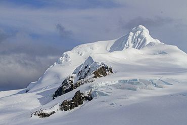 View of snow-covered Livingston Island viewed from Half Moon Island in the South Shetland Group, Antarctica, Polar Regions