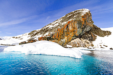 View of calm seas and reflected mountains surrounding Paradise Bay on the western side of the Antarctic Peninsula, Polar Regions