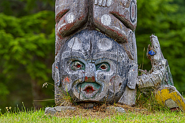 Totem poles in the cemetery of the First Nations Kwakwaka'wakw people in Alert Bay, British Columbia, Canada, North America