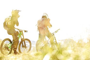 Two freeride mountain bikers off-roading, Chatel, Haute-Savoie, France