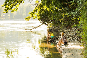 Two young women at river Rhine, Rheinfelden, Baden-Wuerttemberg, Germany