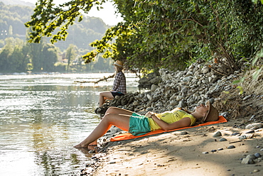 Two young women at river Rhine, Rheinfelden, Baden-Wuerttemberg, Germany