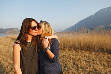 Two young women near Grosser Alpsee, Immenstadt, Bavaria, Germany