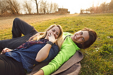 Young couple on a blanket, Grosser Alpsee, Immenstadt, Bavaria, Germany