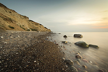 Large stones on a pebble beach at the Baltic Sea in the evening mood, Wustrow, Darss, Mecklenburg Vorpommern, Germany