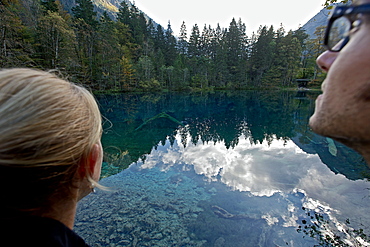 Couple at a lake, Oberstdorf, Bavaria, Germany