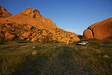 Family camping at the bottom at mount Spitzkoppe, Damaraland, Namibia, Africa